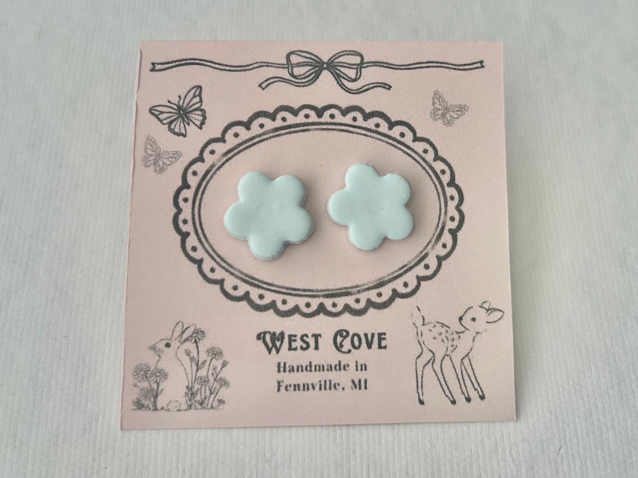 Light blue daisy polymer clay earrings, 0.5 in, hypoallergenic stainless steel backings, handmade in Fennville, MI