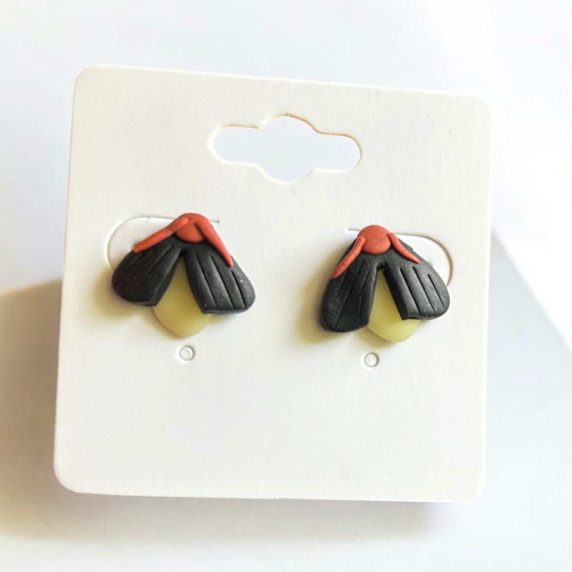 Glow in the dark firefly earrings polymer clay handmade by West Cove