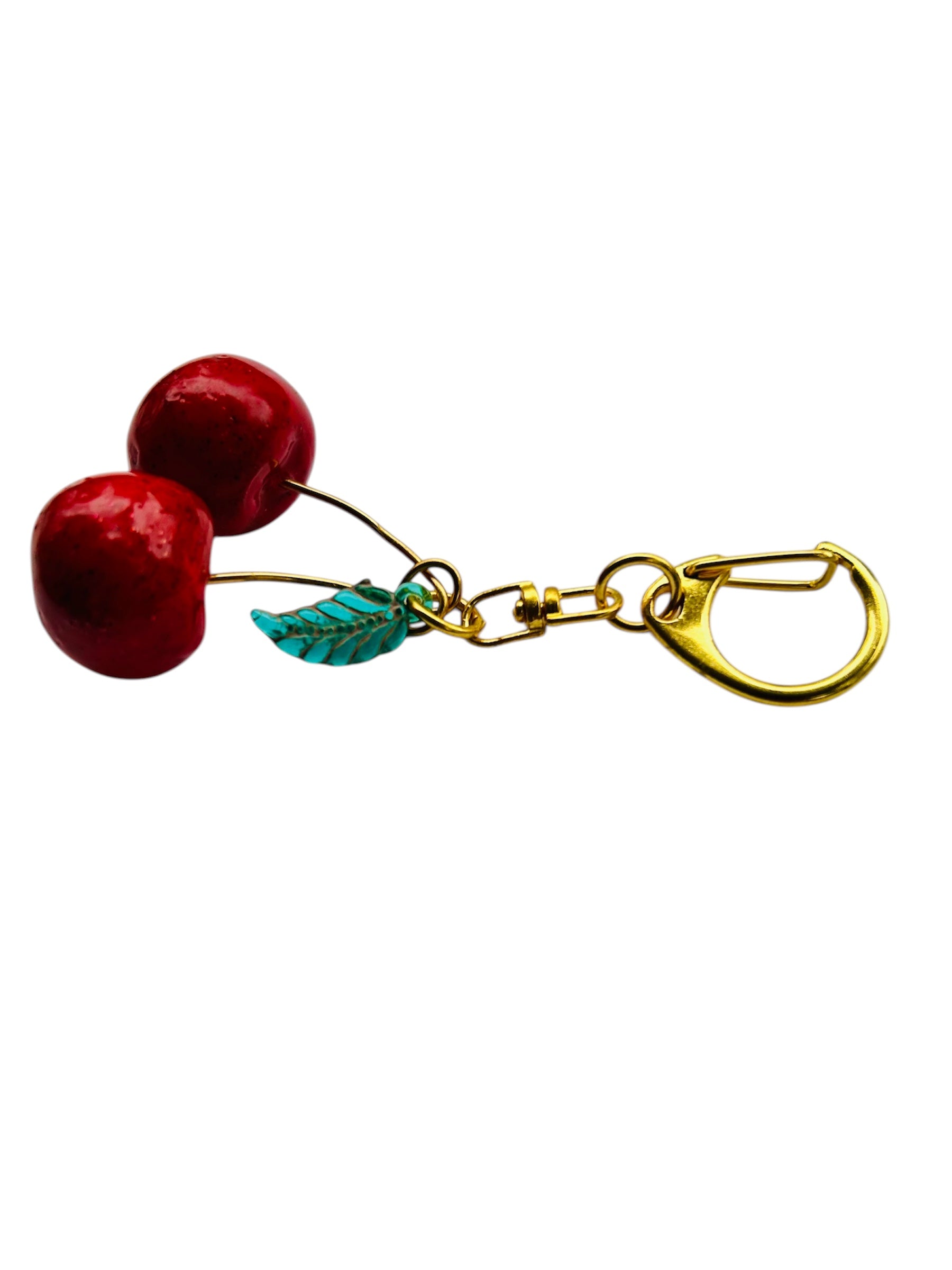 Cherry Charm Keychain for Women: red polymer cherries, green glass leaf bead, copper knot, gold clasp.