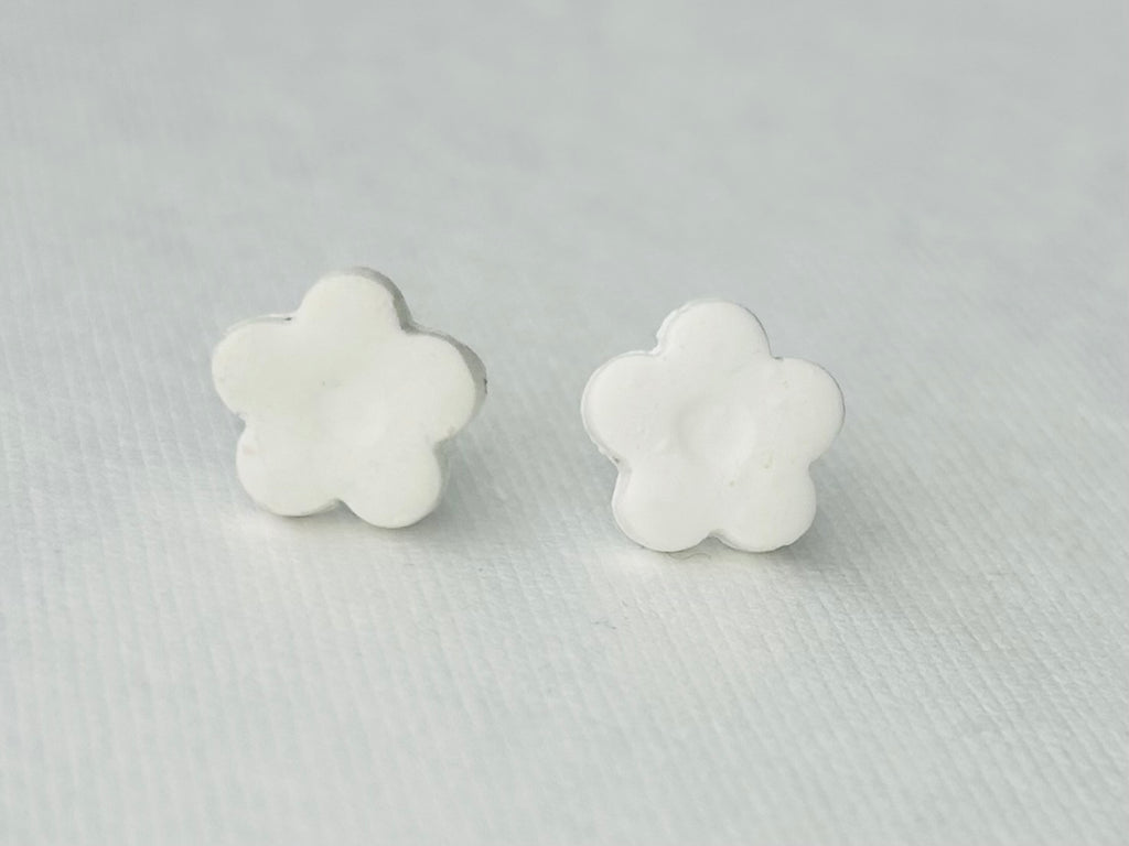 White daisy flower polymer clay earrings with hypoallergenic stainless steel backs, handmade in Michigan.