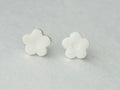 White daisy flower polymer clay earrings with hypoallergenic stainless steel backs, handmade in Michigan.