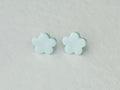 Light blue daisy polymer clay earrings with stainless steel hypoallergenic backs, handmade in Fennville, MI.